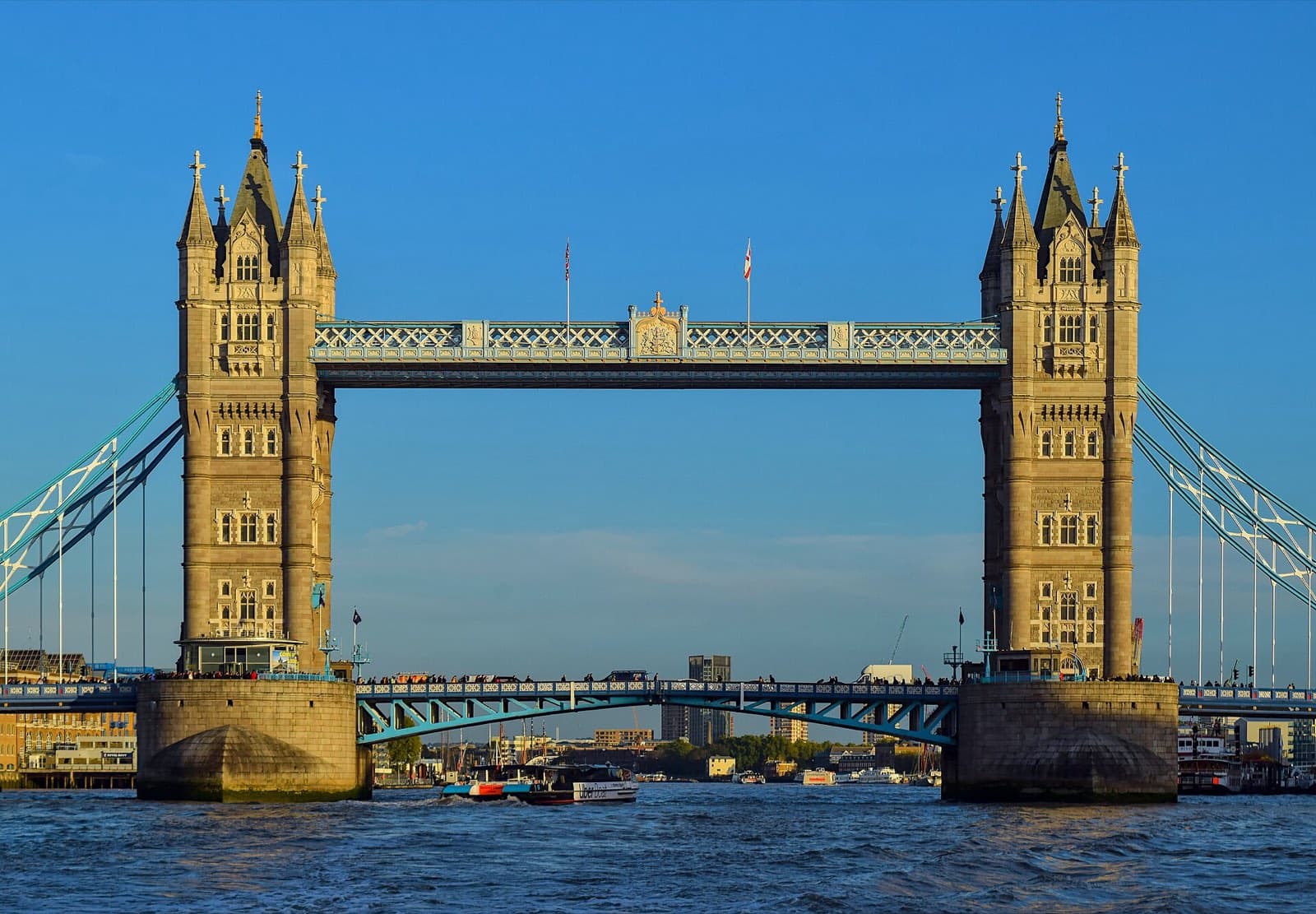 Tower Bridge over the Thames in London at golden hour.