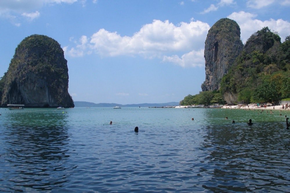 Limestone cliffs rising over the beach at Railay, Krabi, Thailand.